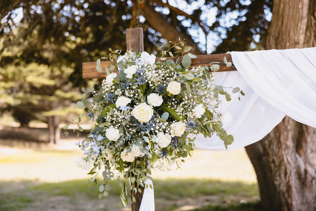 wedding flowers on wedding arch