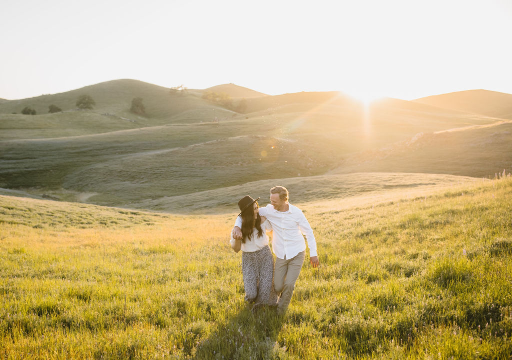 Man and woman walking through a wilfflower valley in Fresno California 