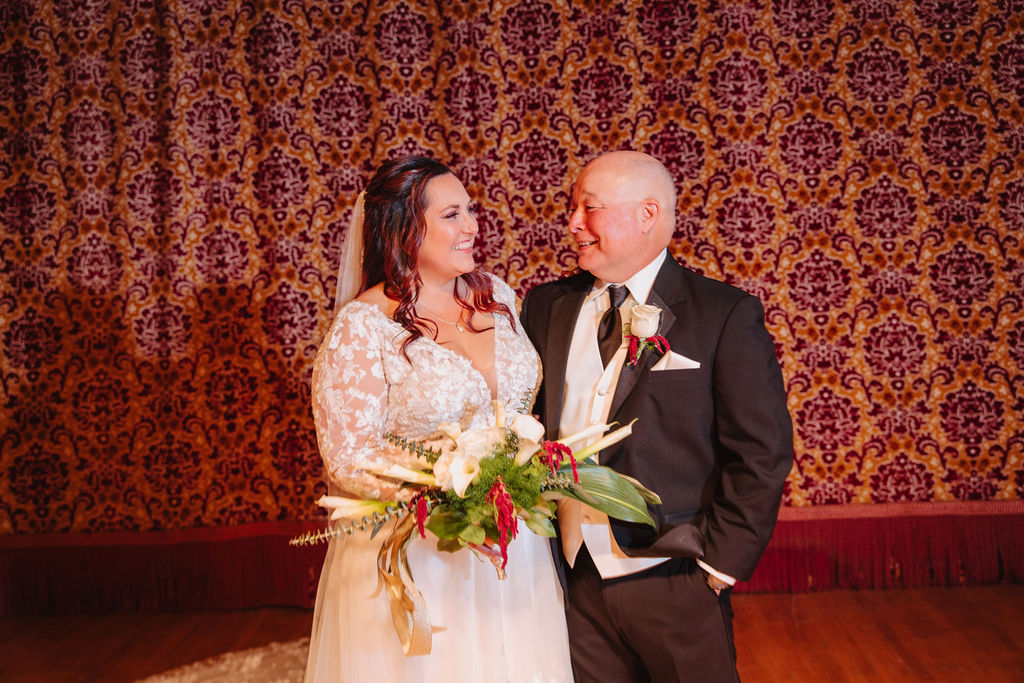 Bride and groom portraits for wedding at Warnors Theatre in Fresno California