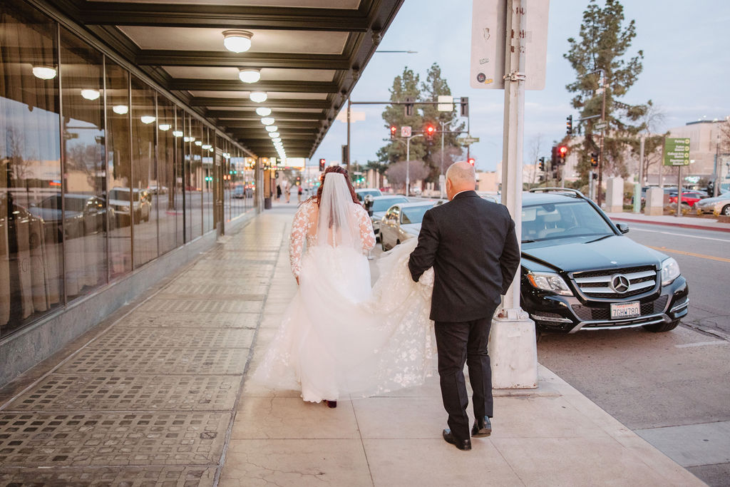Bride and groom portraits for wedding at Warnors Theatre in Fresno California