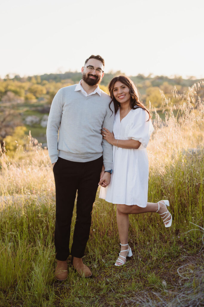 Couple posing engagement photos in Fresno California