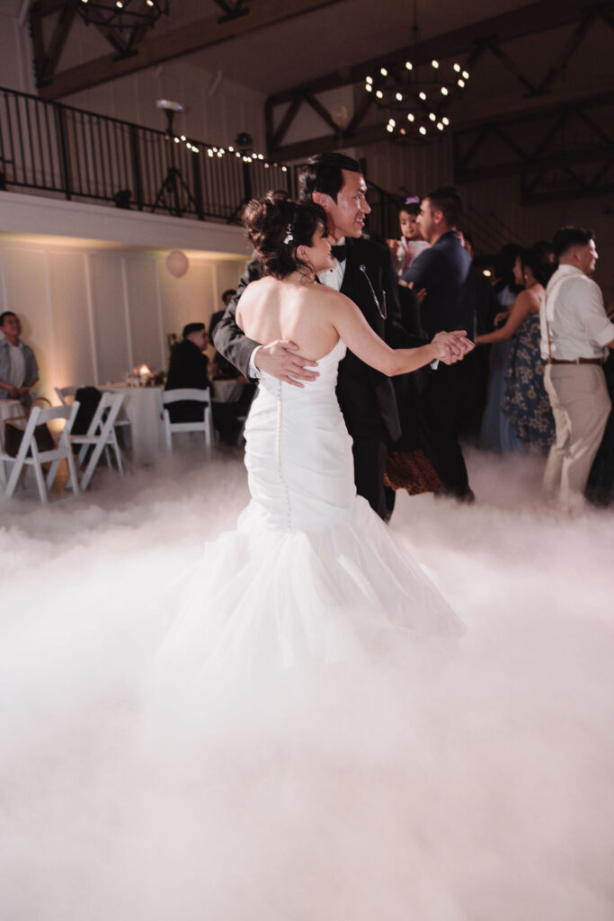 bride and groom dancing on the cloud