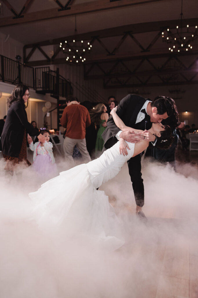 bride and groom dancing on the cloud