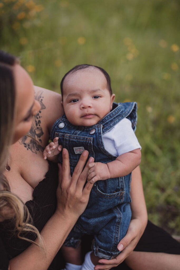 Woman holding baby during photo session