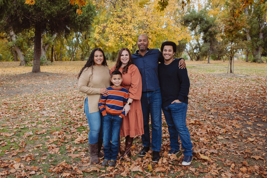 Family posing for photos during their Fresno fall mini session.