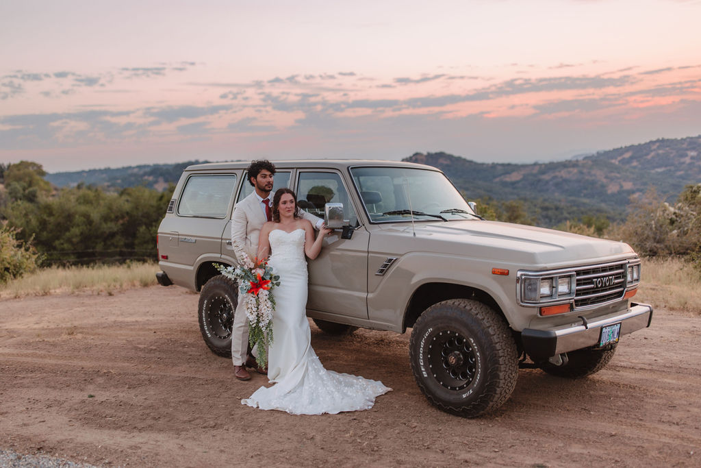 Bride and grooms sunset portraits with Jeep from California elopement
