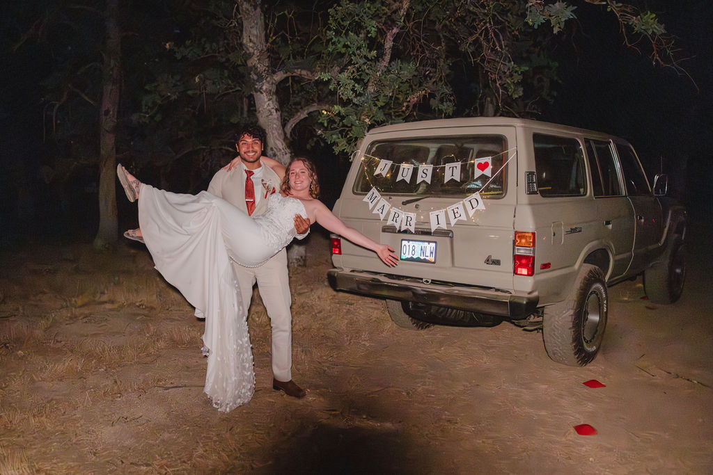 Bride and grooms jeep wedding exit