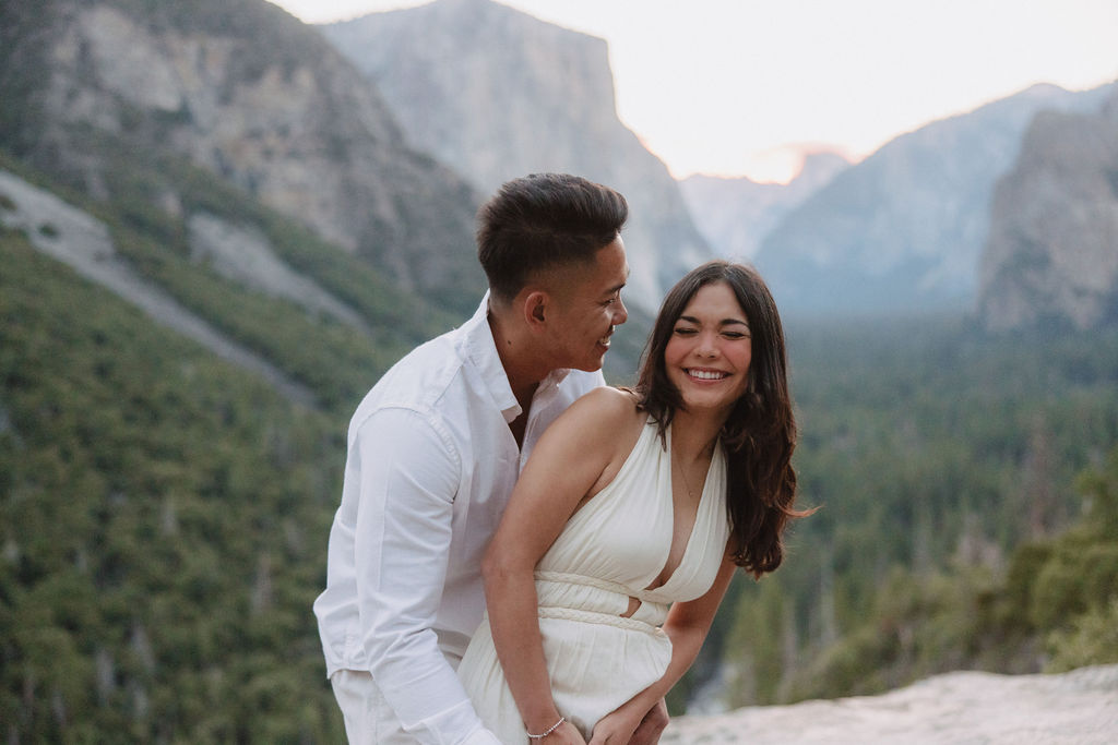 Couple posing for photos in the mountains