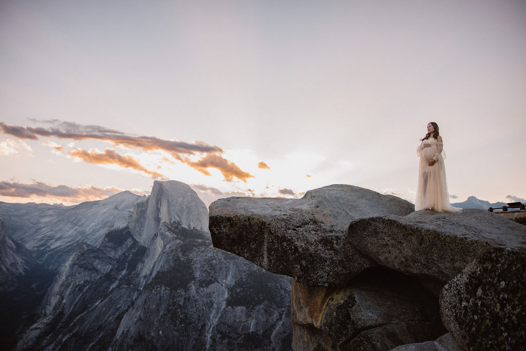 Woman posing for maternity session at Glacier Point in Yosemite National Park