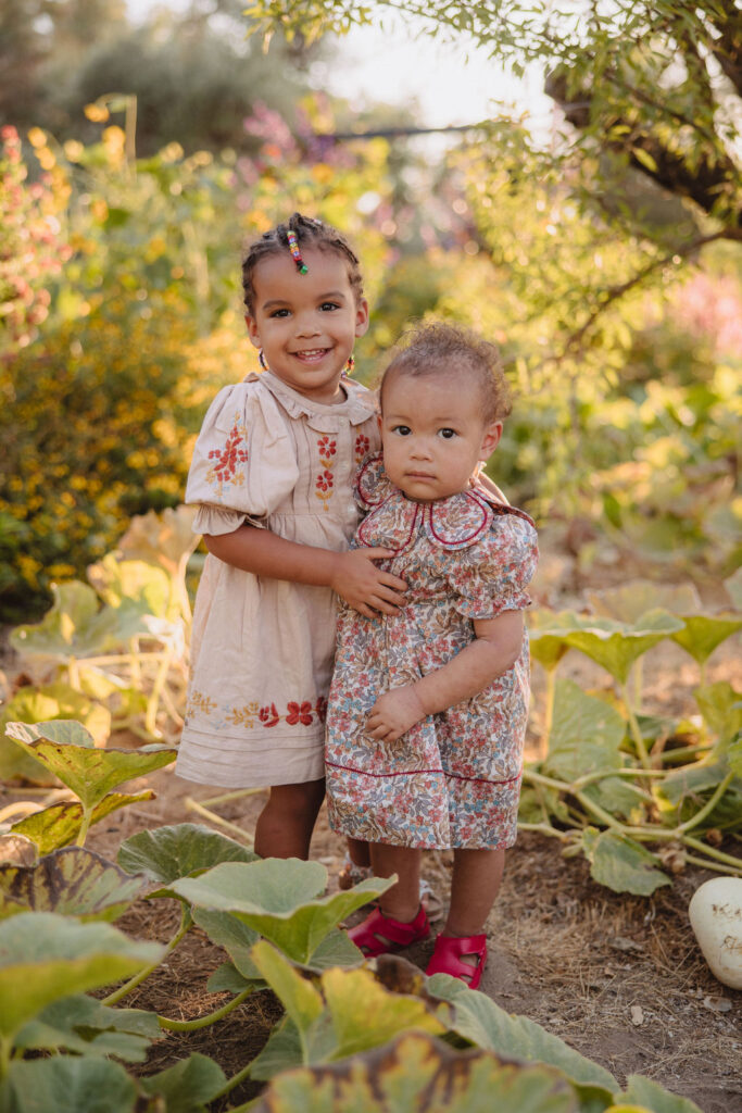 babies posing with flowers