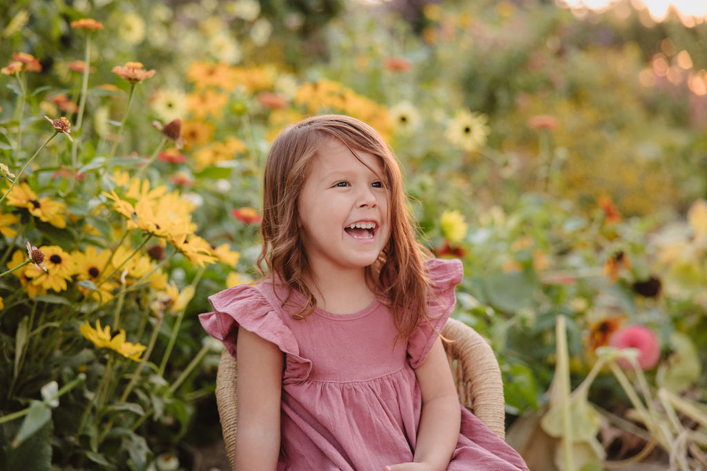 girl laughing in flowers