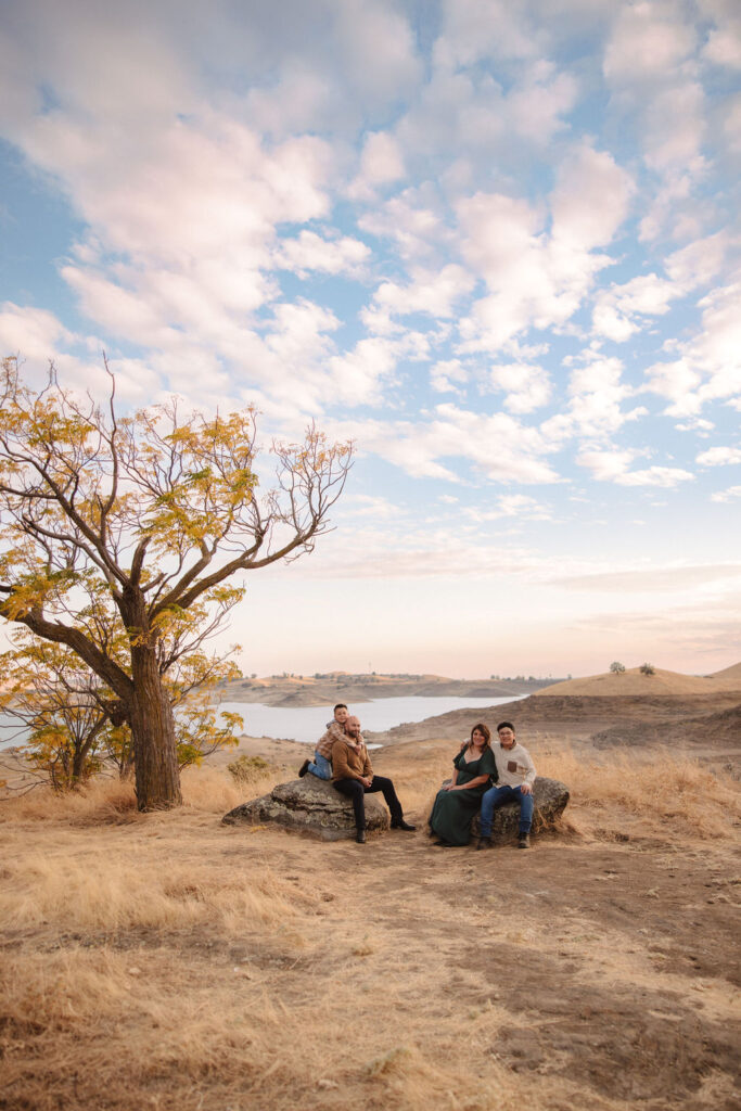 An outdoor fall family maternity photoshoot at Millerton Lake in Fresno, California