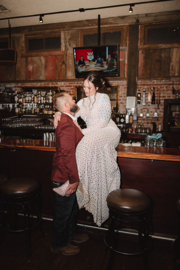 Bride and groom bar portraits from a A Fall Vintage Boho Wedding in California