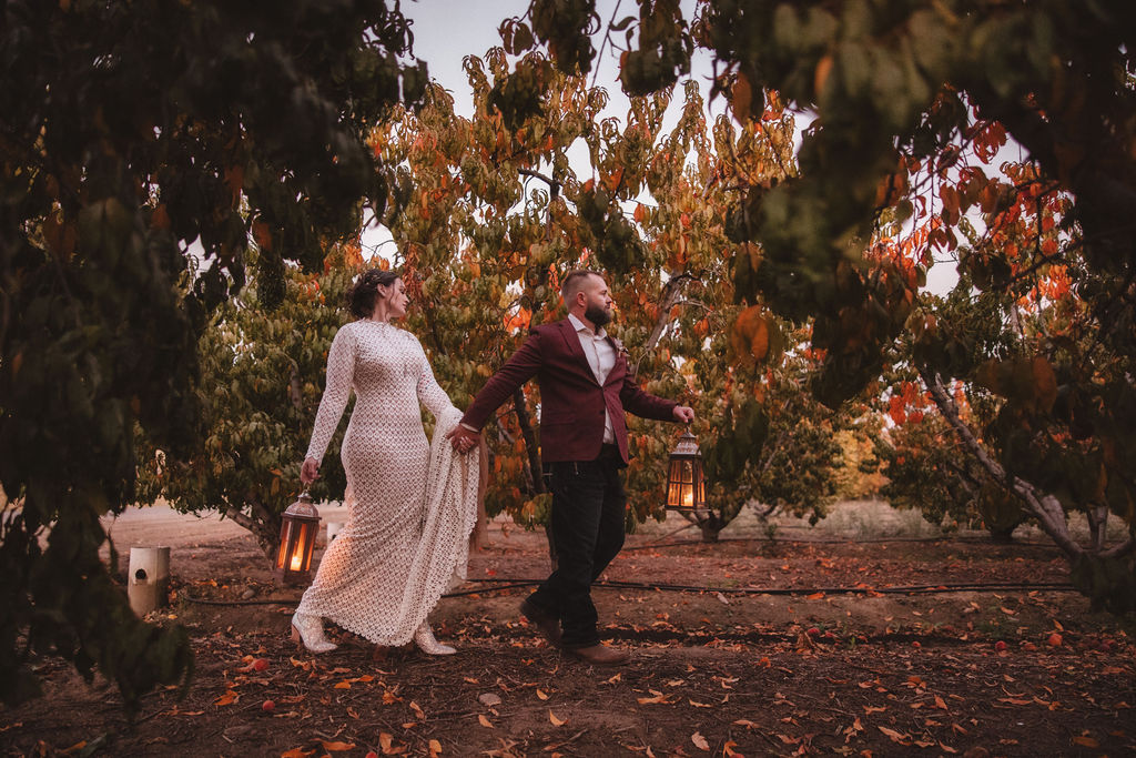 Bride and groom lantern portraits from a A Fall Vintage Boho Wedding in California