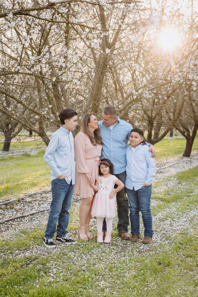 Family posing during their blossom session in Fresno ca