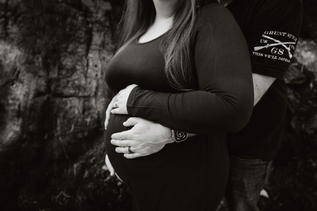 Pregnant woman posing for photos outdoors