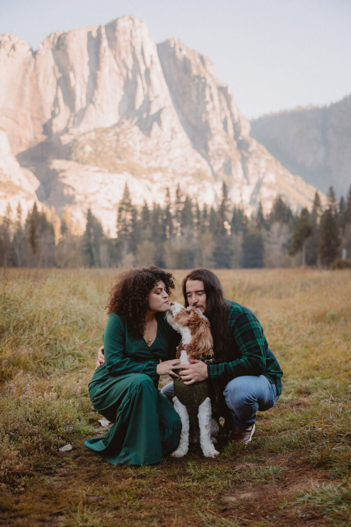 Couple with their dog at swinging bridge meadow in yosemite