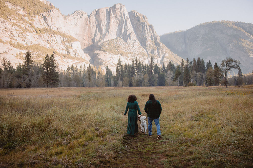 Couple walking in field Yosemite park