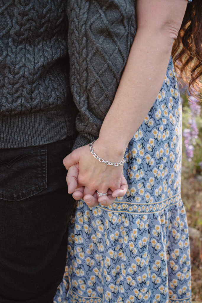 couple holding hands at winton park