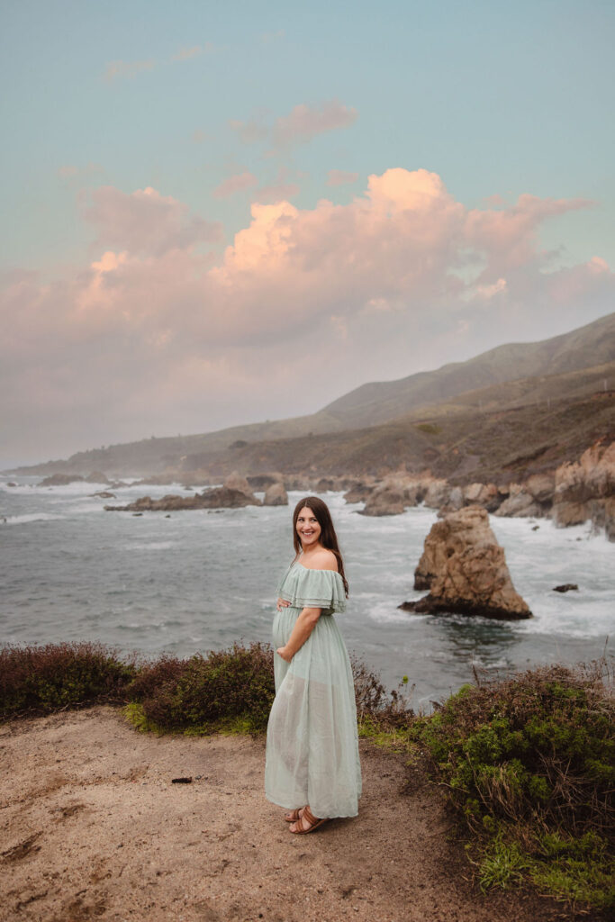 photo of soon to be mom on cliffside in big sur