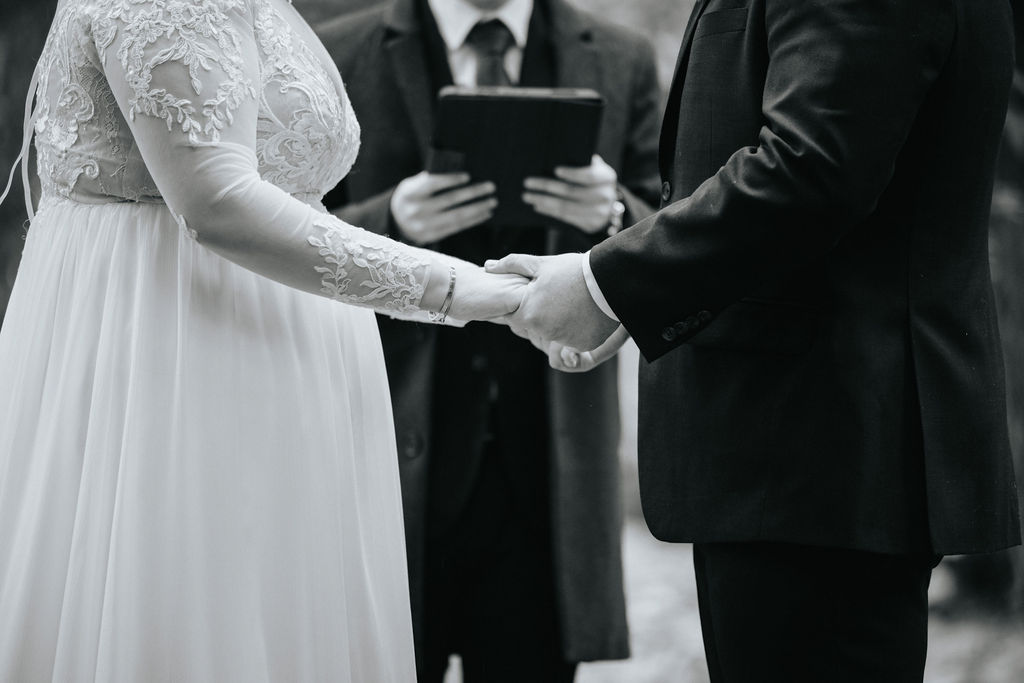 bride and groom posing for their wedding portraits
