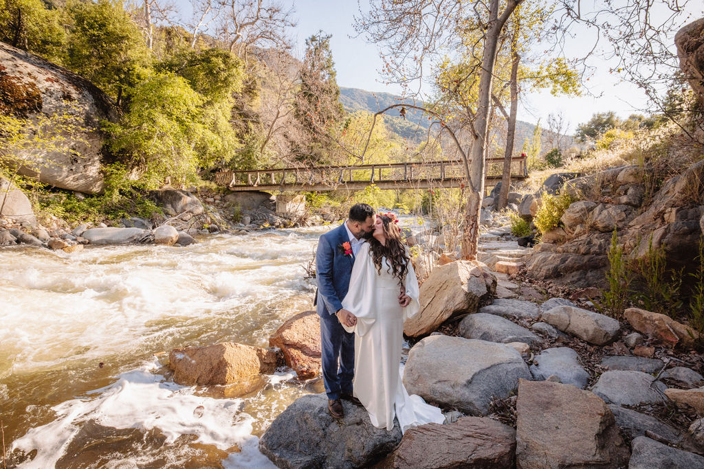 bride and groom posing for their outdoor wedding photos
