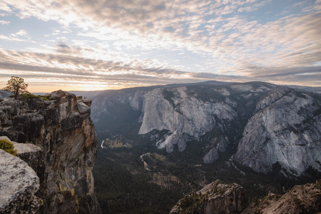 Taft point Yosemite engagement photos at sunset in the fall. Far away photo where the couple is small so you can see the scenery. 