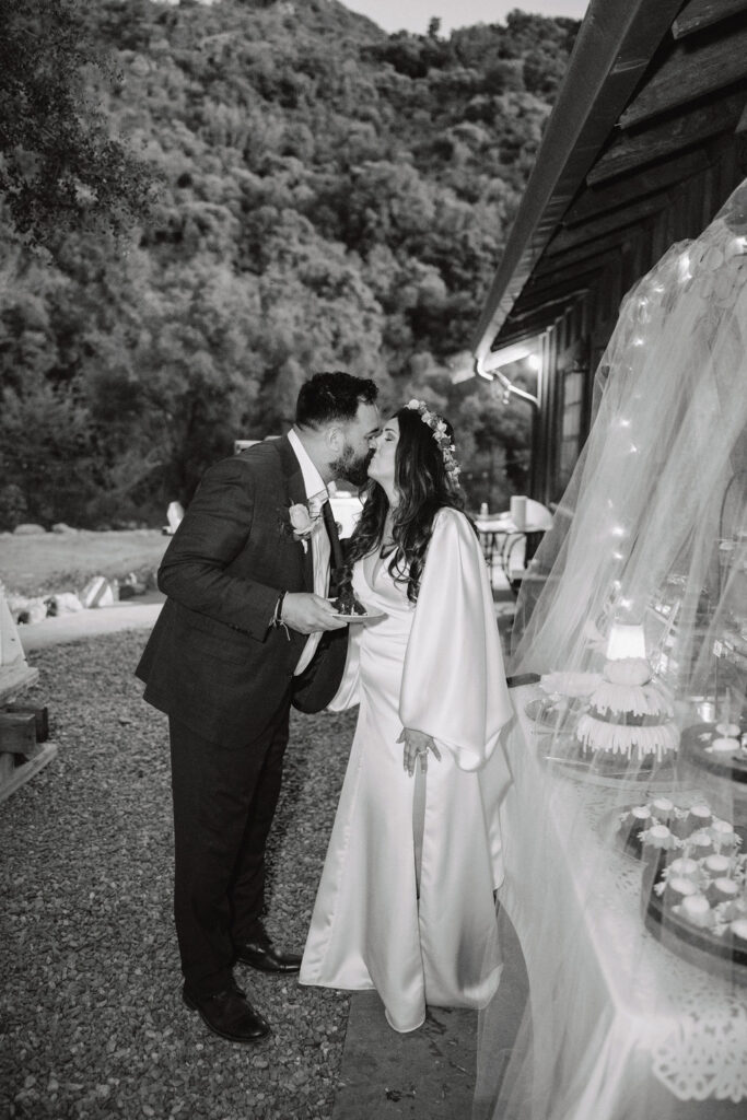 bride and groom posing for their outdoor wedding photos
