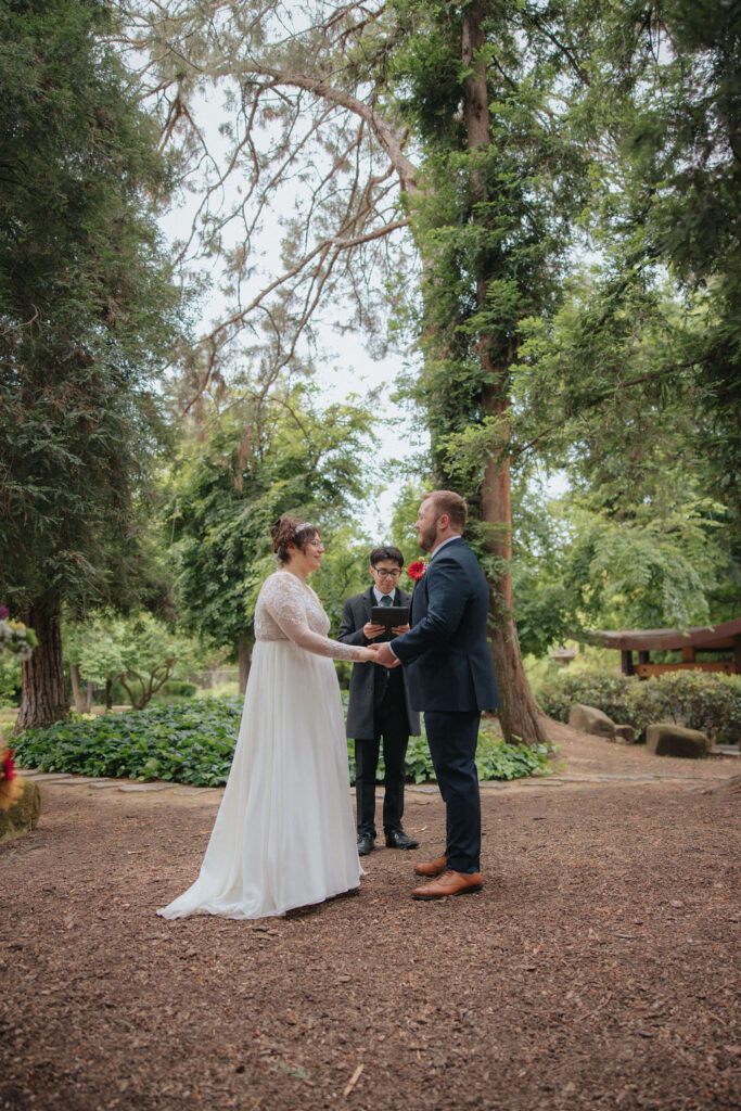 bride and groom posing for their wedding portraits at Shinzen Friendship Garden