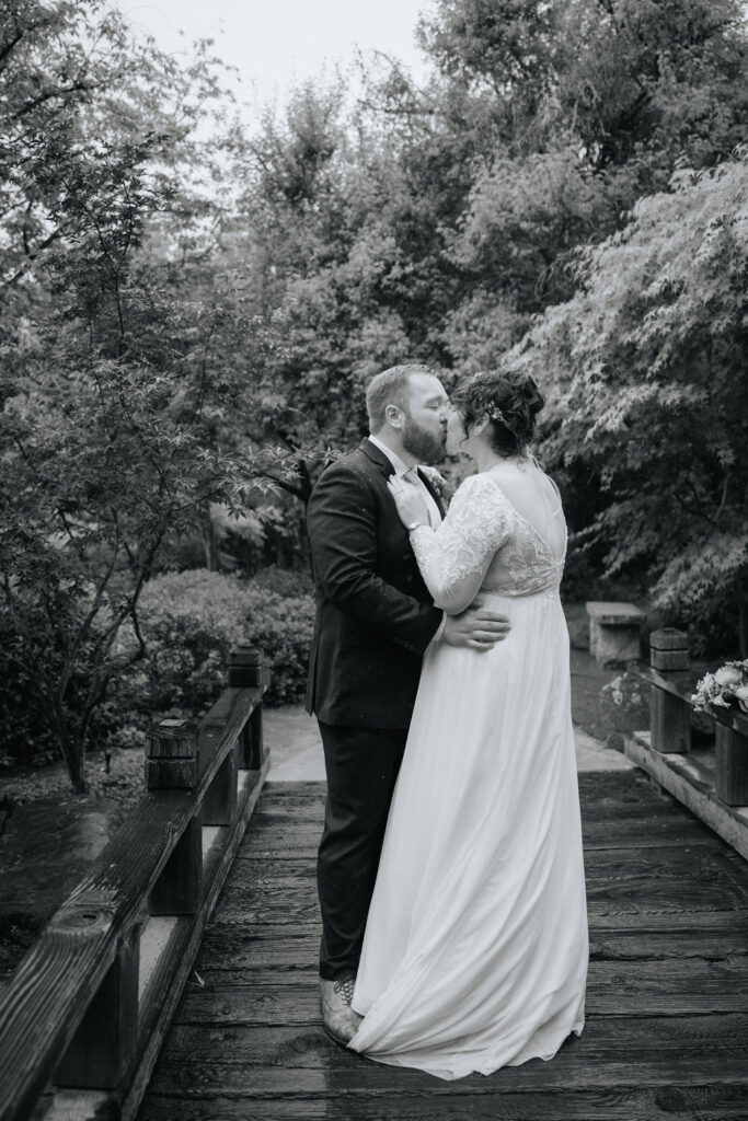 bride and groom posing for their wedding portraits
