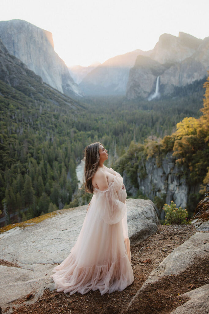 couple posing in Yosemite for their maternity photos
