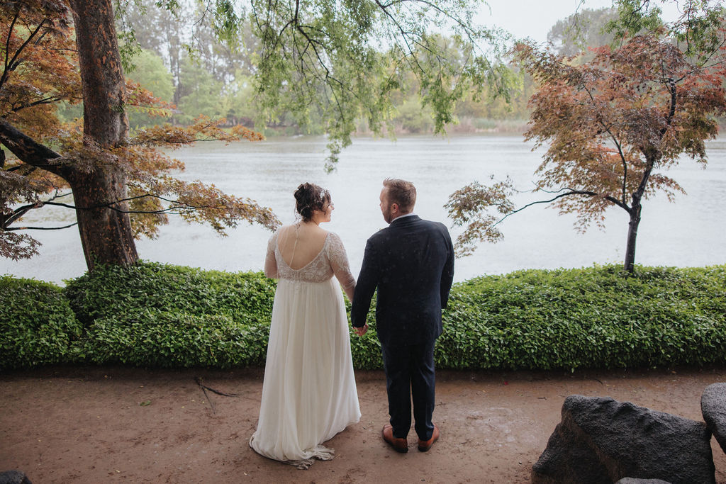 bride and groom posing for their wedding portraits
