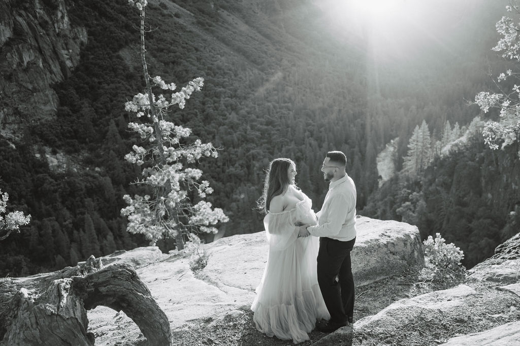 couple kissing during photoshoot in the mountains