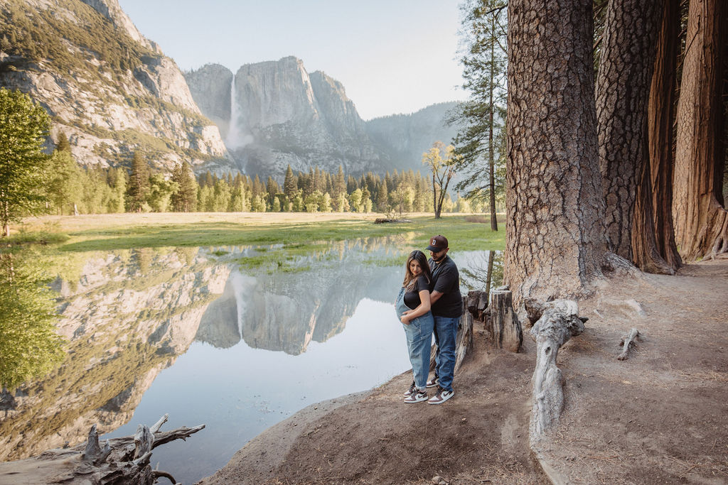 couple posing in Yosemite for their maternity photos
