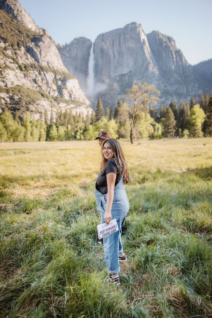 couple posing in the mountains for their maternity photos
