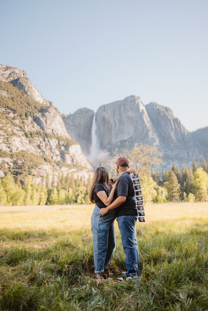 couple posing in Yosemite for their maternity photos
