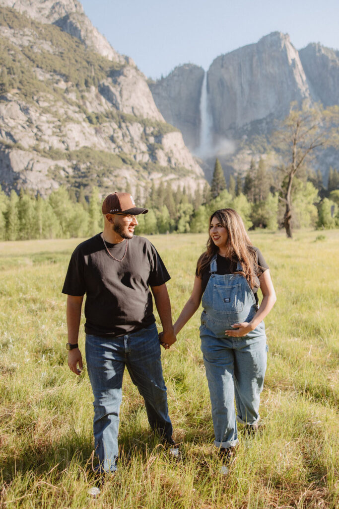 couple posing for a maternity session outdoors
