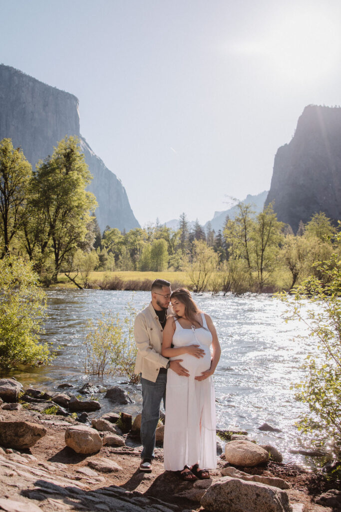 couple posing in Yosemite for their maternity photos
