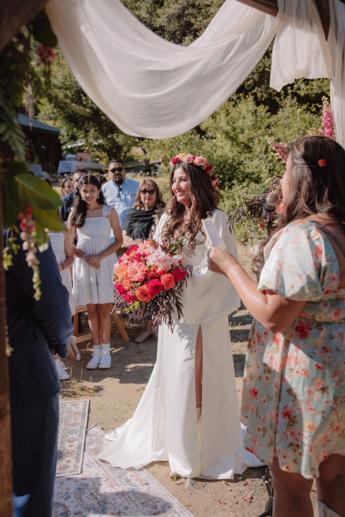 bride and groom posing for their outdoor wedding photos | wedding details during a redwood ranch wedding
