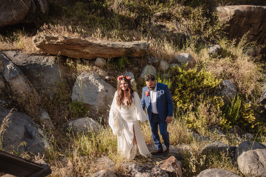 bride and groom posing for their outdoor wedding photos
