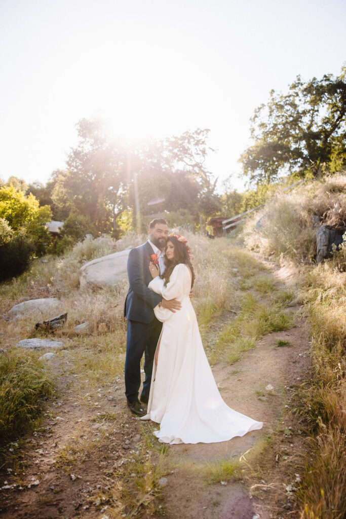 bride and groom posing for their outdoor wedding photos | An Intimate Redwood Ranch Wedding in Three Rivers