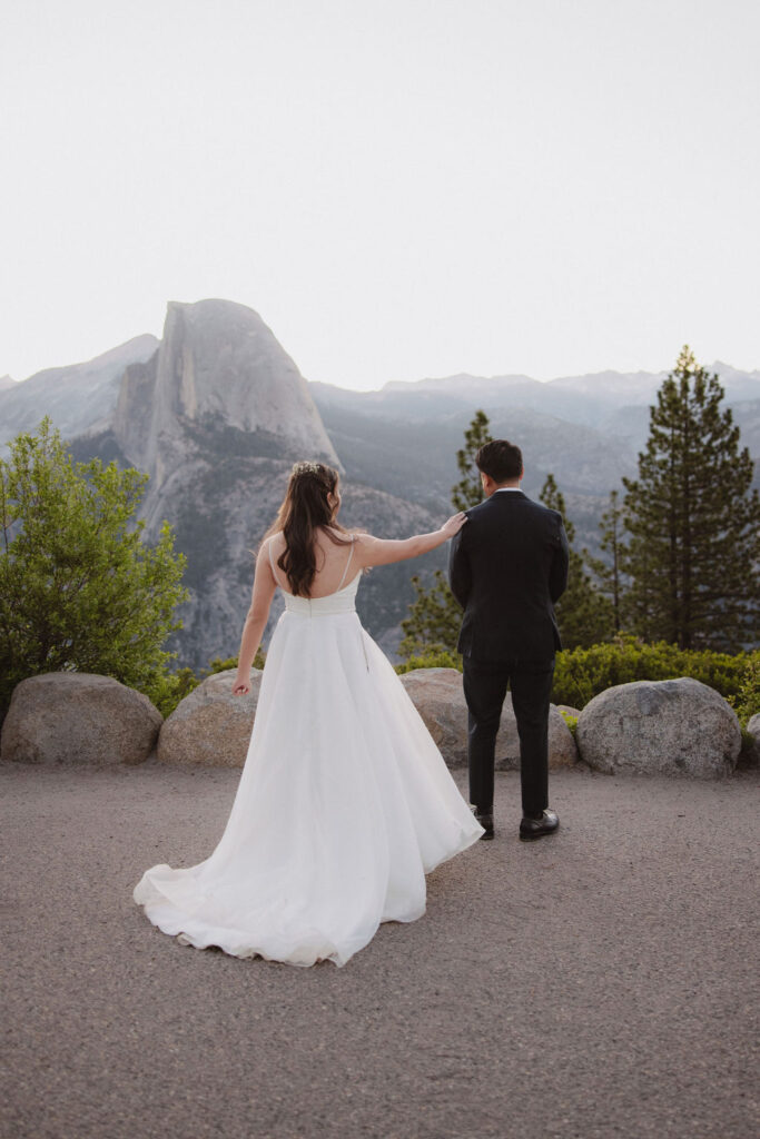 bride and groom sharing a first look at Yosemite national park during sunrise