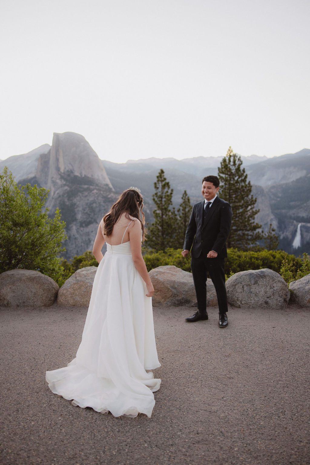 bride and groom sharing a first look at Yosemite national park during sunrise