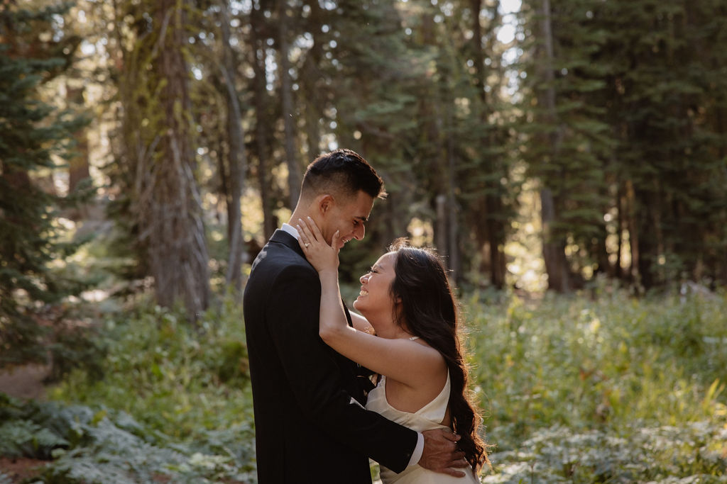 couple hiking through the woods during their yosemite elopement| best views at Yosemite National Park