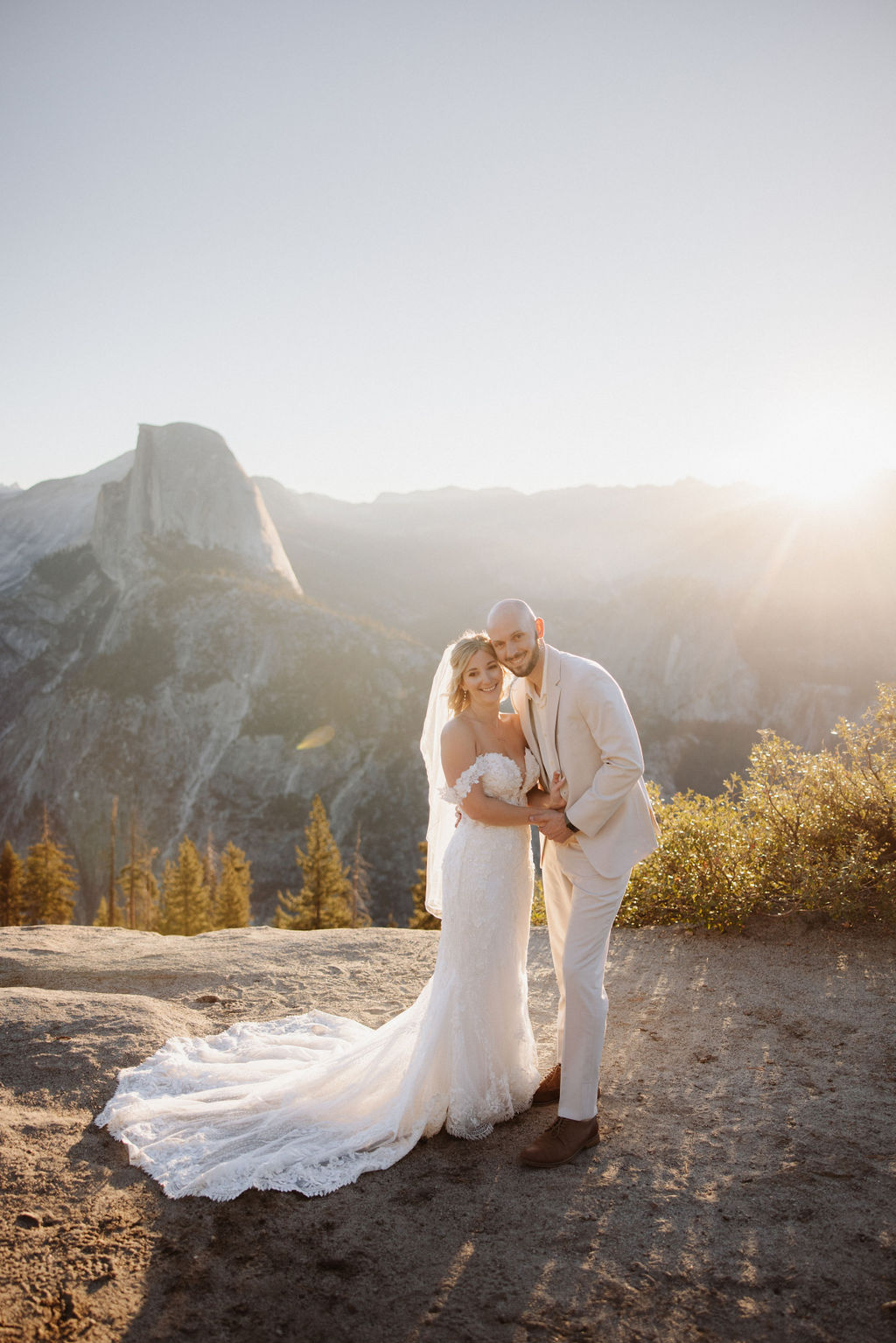 bride and groom take wedding portraits at glacier point for their yosemite wedding