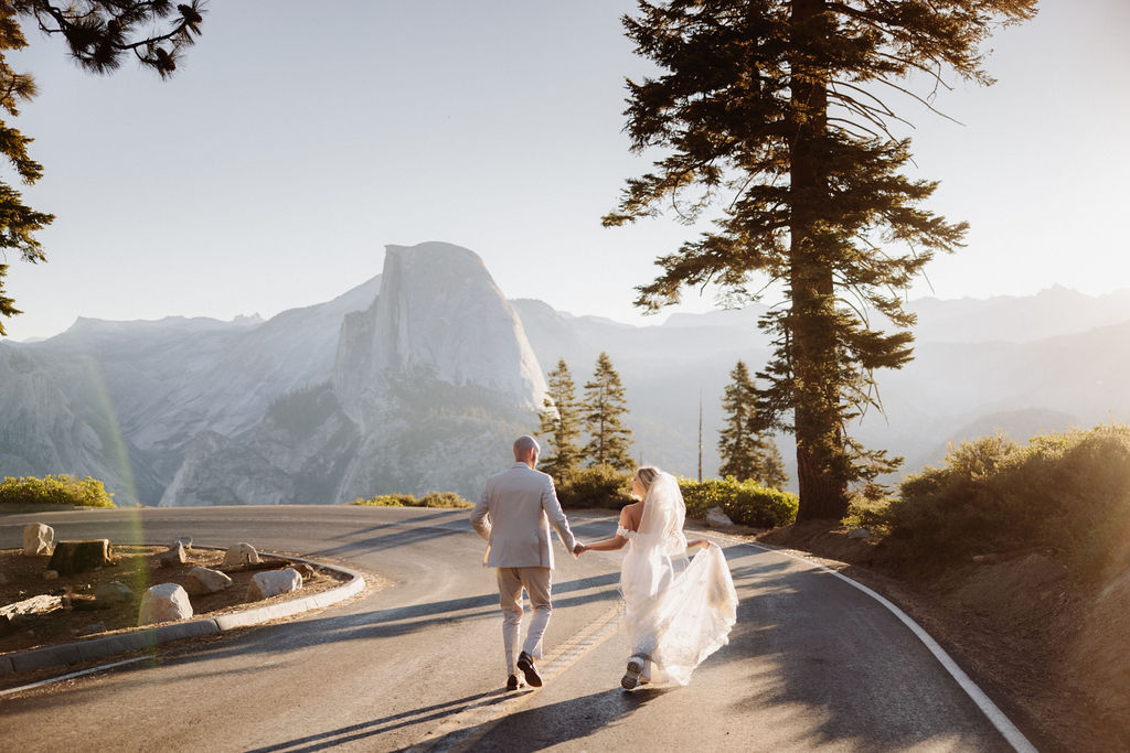  bride and groom take wedding portraits at glacier point for their yosemite wedding