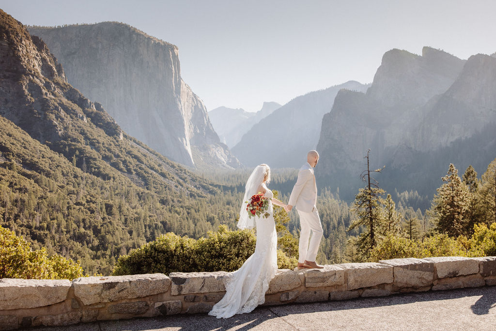 bride and groom take wedding portraits at Yosemite valley for their yosemite wedding