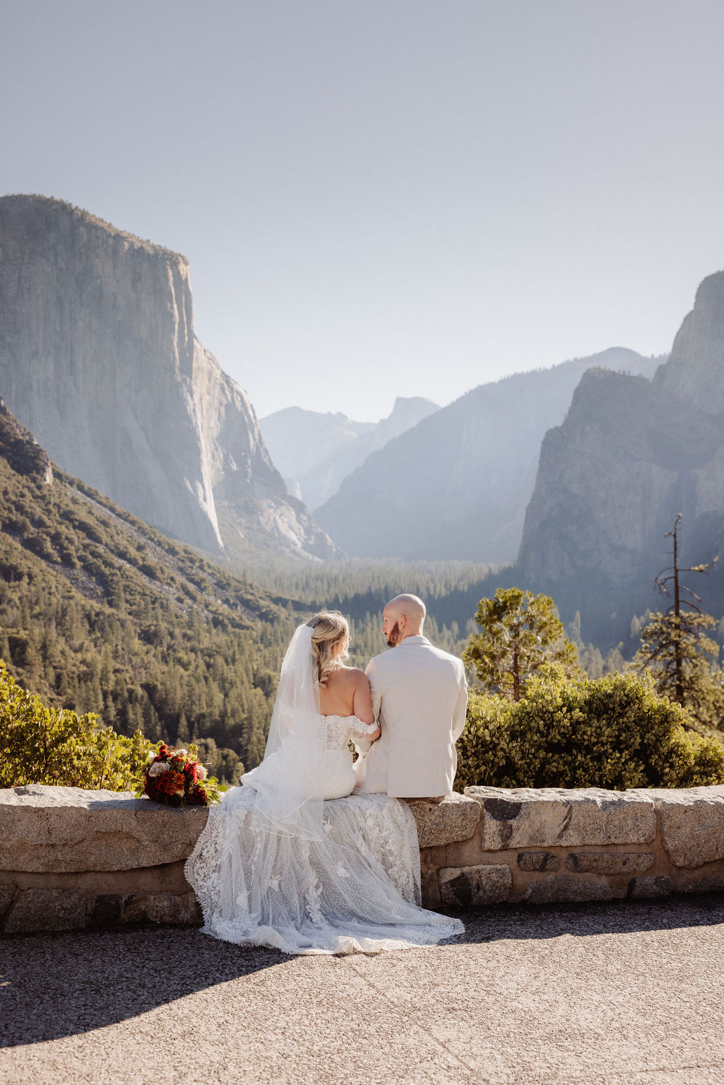 bride and groom take wedding portraits at Yosemite valley for their yosemite wedding