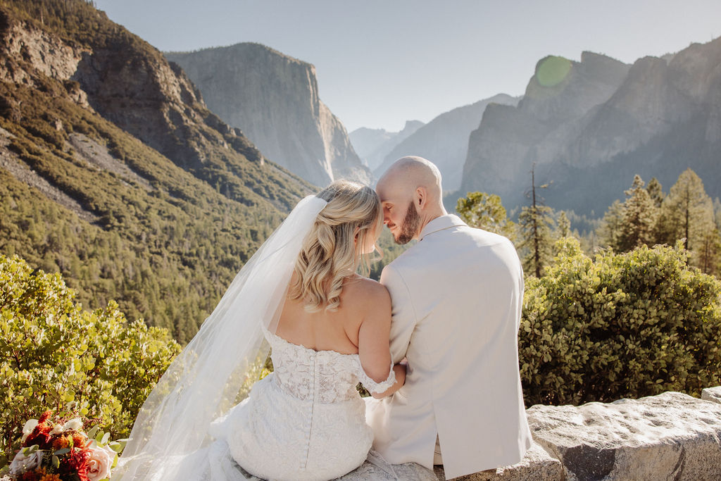 bride and groom take wedding portraits at Yosemite valley for their yosemite wedding