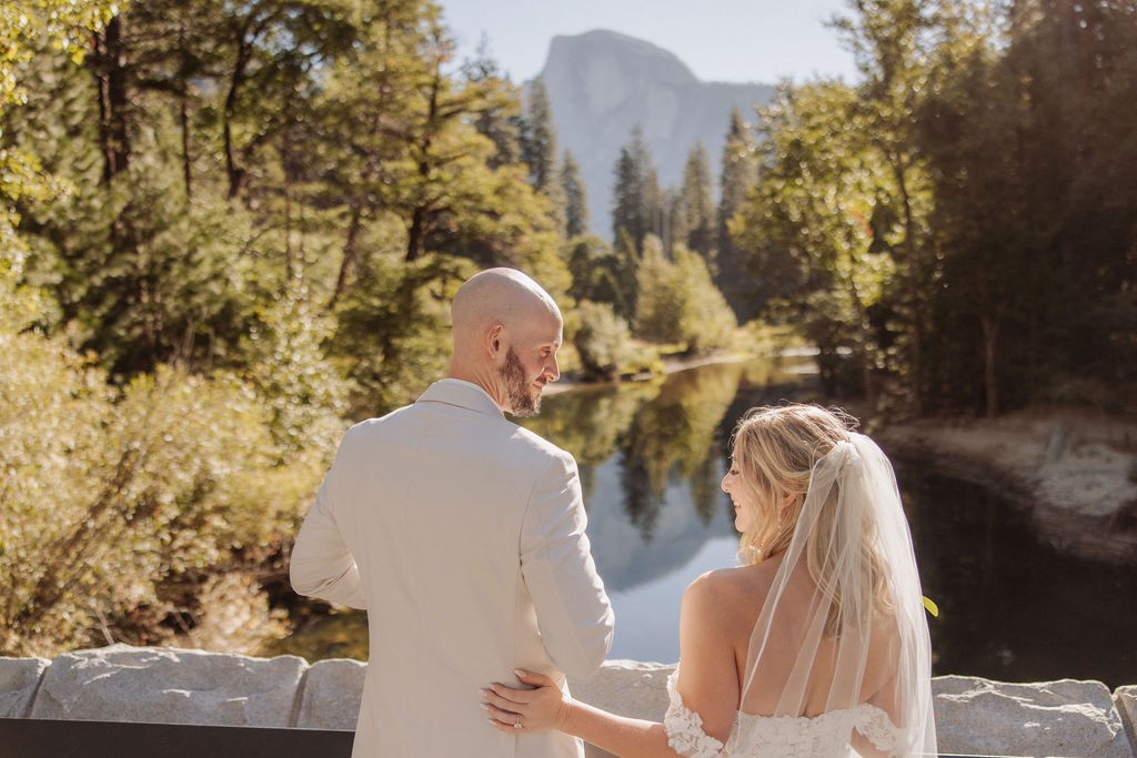 bride and groom take wedding portraits at Yosemite valley for their yosemite wedding